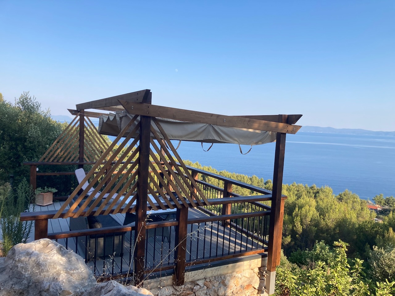Falcons Nest sun deck with seating, sun loungers and retractable shade