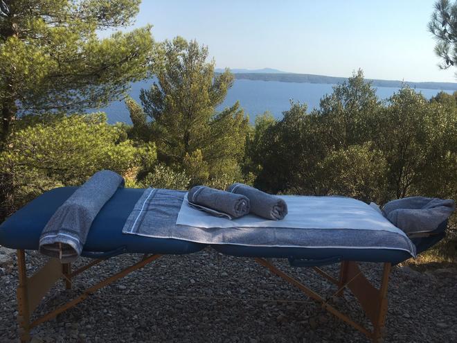 On site masseuse for Swedish & Sport massage. On a natural rock platform, surrounded by nature and with sea views.